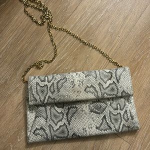 Brand new snakeskin crossbody clutch